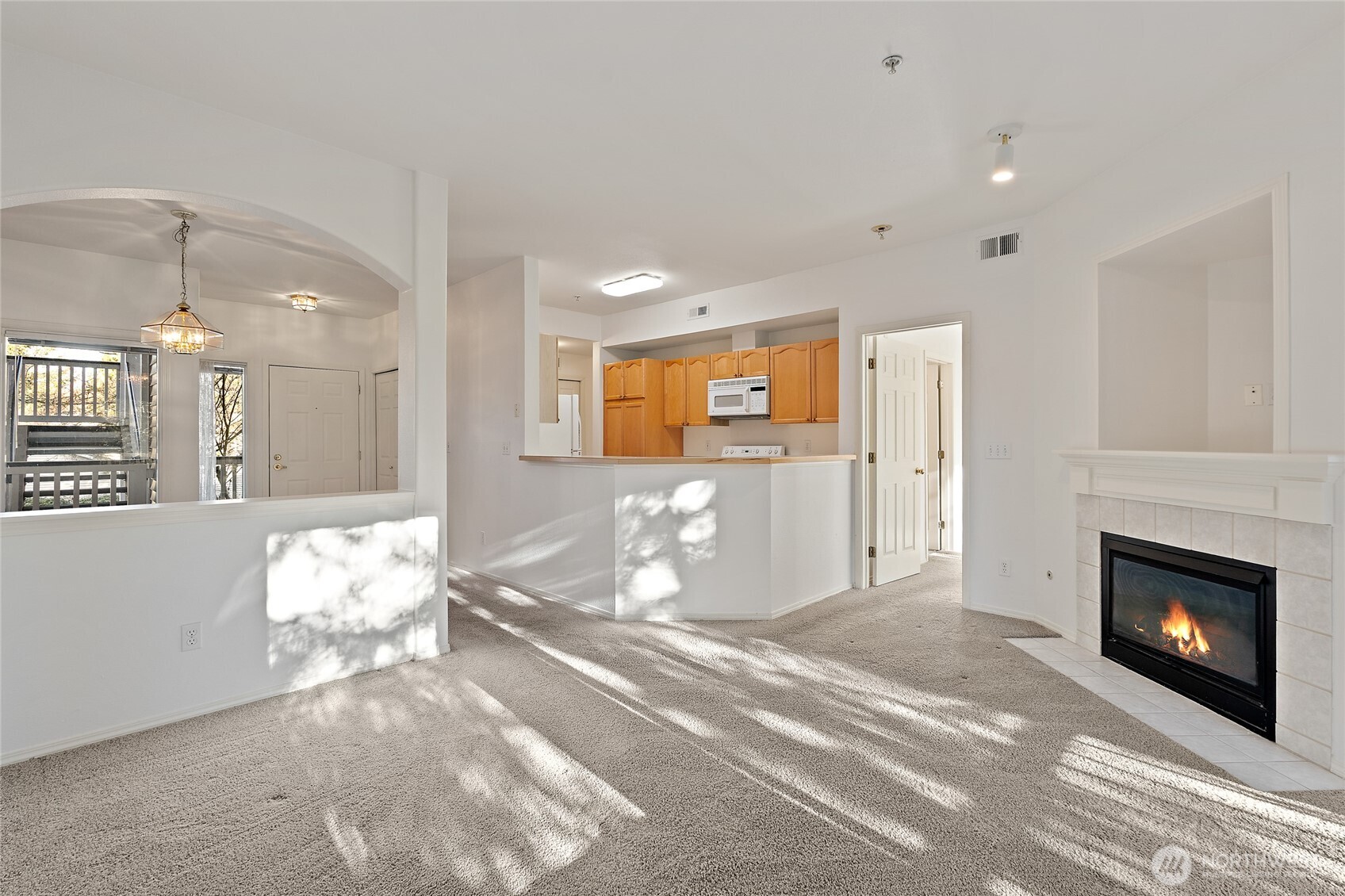 12122 Northeast 171st Place, Unit D201 Bothell, WA 98011 - Photo 19 of 33 a view of a livingroom with a fireplace
