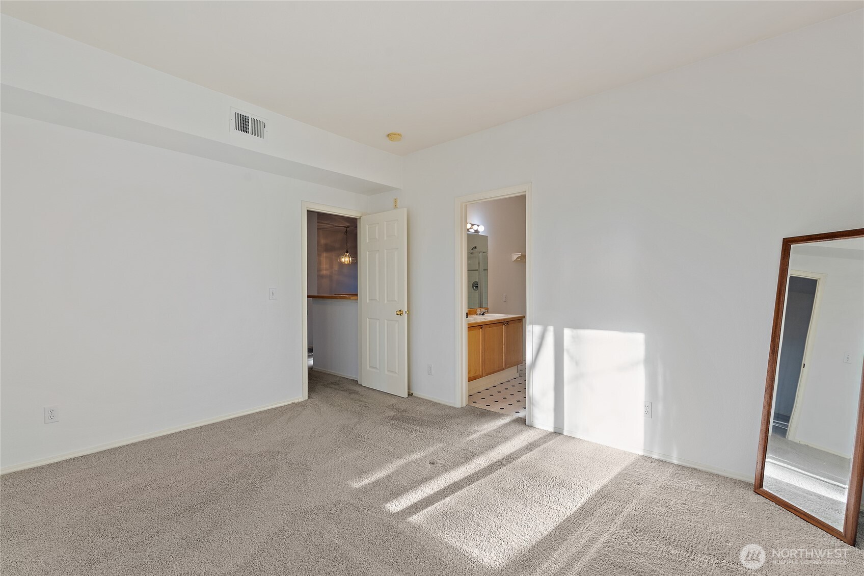 12122 Northeast 171st Place, Unit D201 Bothell, WA 98011 - Photo 23 of 33 wooden floor in an empty room with a window