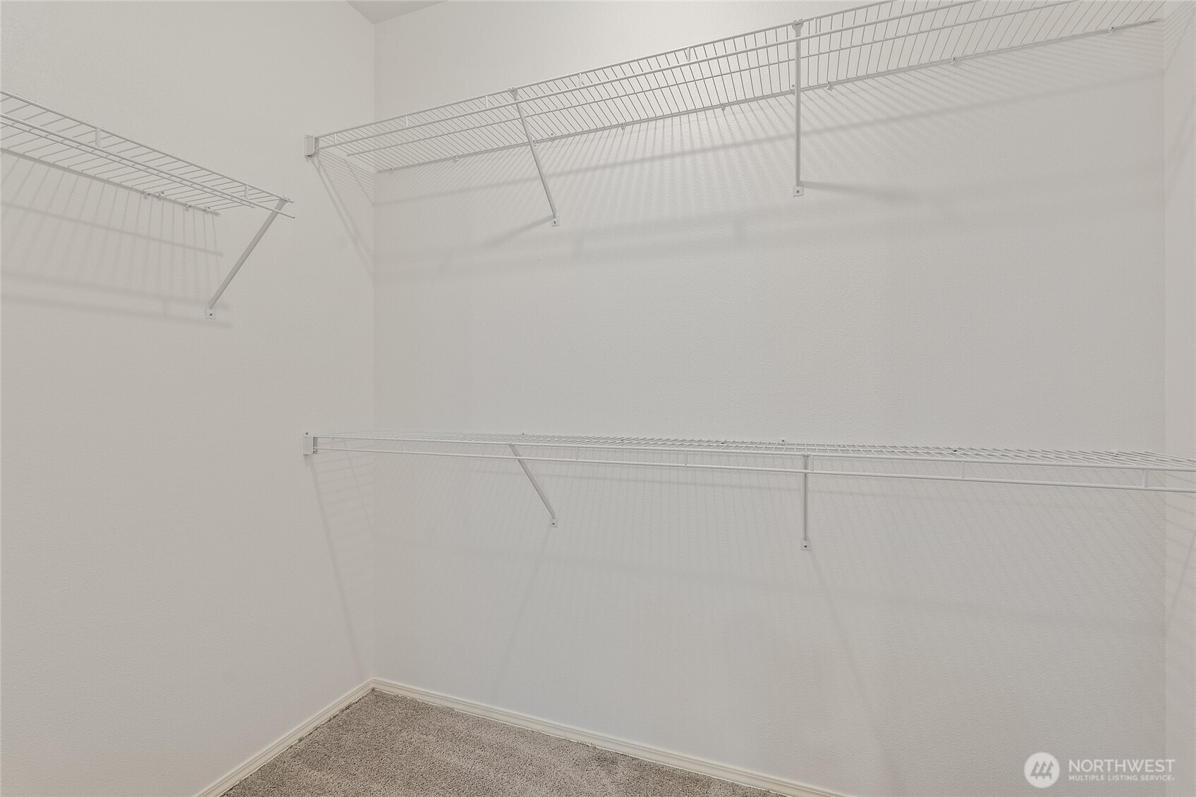 12122 Northeast 171st Place, Unit D201 Bothell, WA 98011 - Photo 25 of 33 a view of a room with racks on the wall