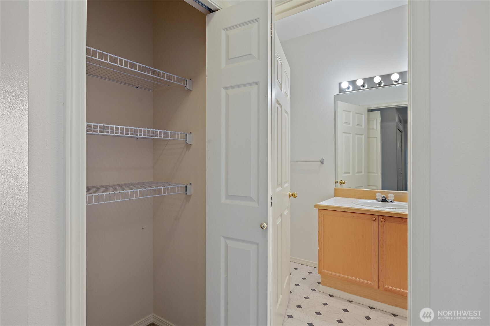 12122 Northeast 171st Place, Unit D201 Bothell, WA 98011 - Photo 29 of 33 a bathroom with a sink a toilet and shower
