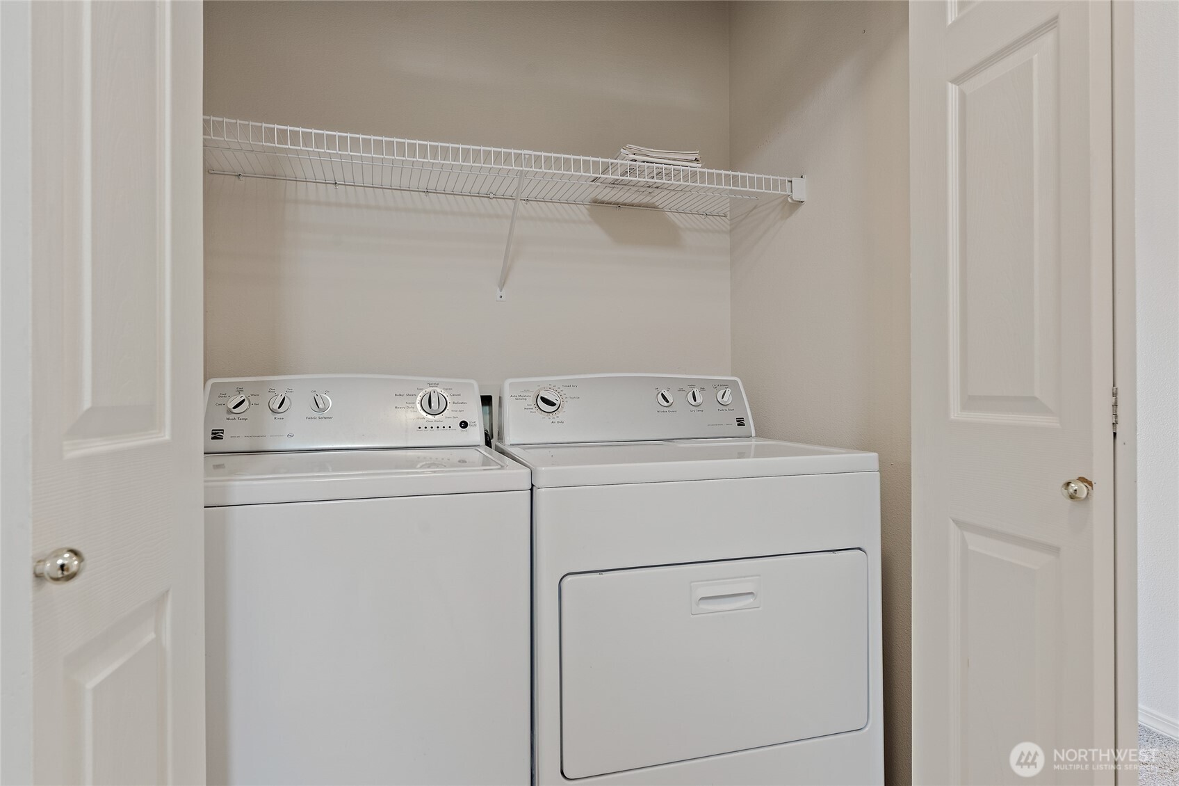 12122 Northeast 171st Place, Unit D201 Bothell, WA 98011 - Photo 30 of 33 a utility room with dryer and washer