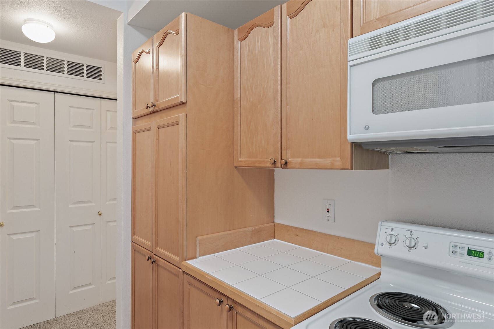 12122 Northeast 171st Place, Unit D201 Bothell, WA 98011 - Photo 10 of 33 a utility room with dryer and washer