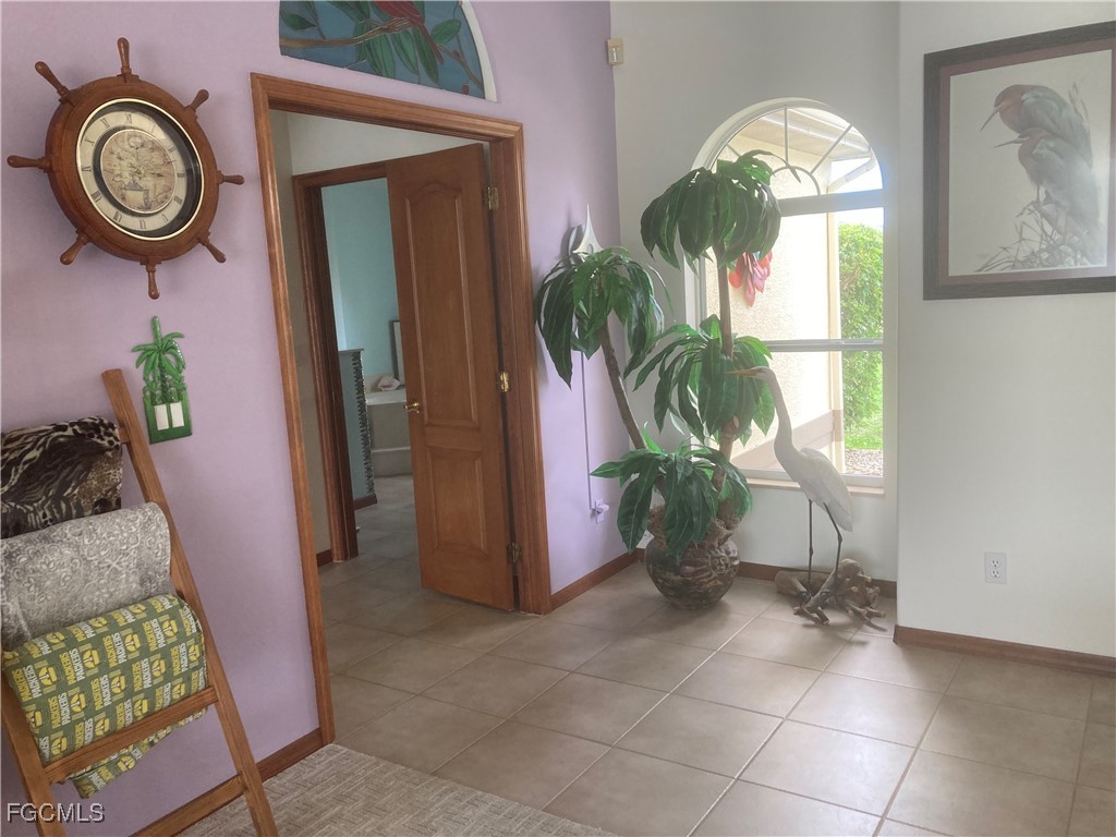 5619 Marina Road Bokeelia, FL 33922 - Photo 3 of 18 a view of a hallway with entryway