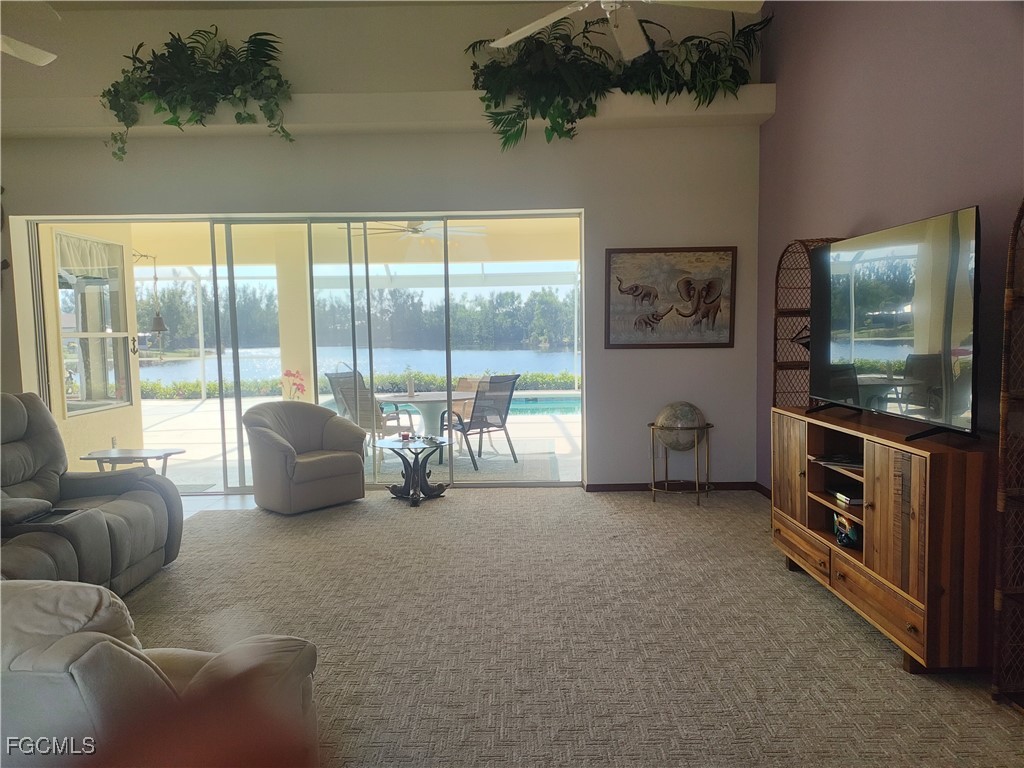 5619 Marina Road Bokeelia, FL 33922 - Photo 4 of 18 a living room with furniture and a flat screen tv