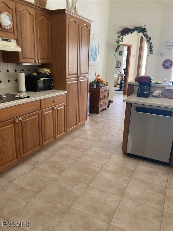5619 Marina Road Bokeelia, FL 33922 - Photo 6 of 18 a kitchen with stainless steel appliances a refrigerator sink and microwave