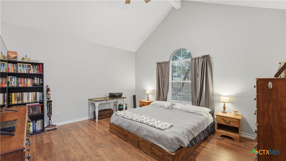 2216 Hornsby Spring Branch, TX 78070 - Photo 14 of 33 a bedroom with a bed and a book shelf