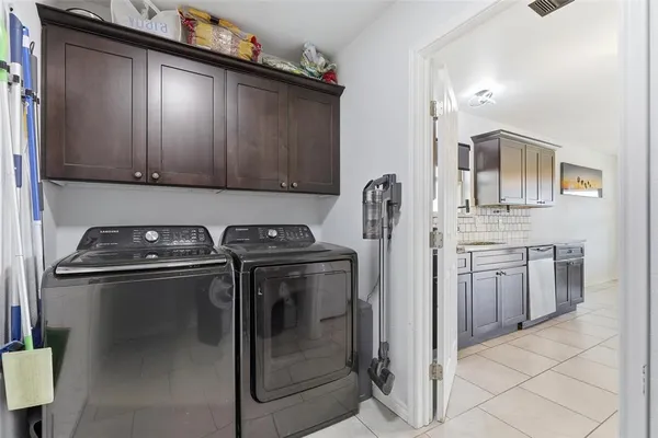 a kitchen with stainless steel appliances granite countertop a stove a refrigerator and a sink