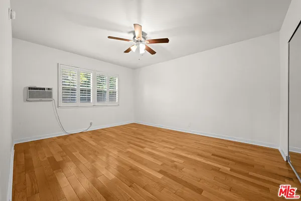 a view of a big room with windows