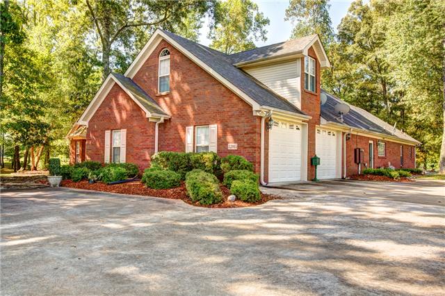 32015 Ardmore Ridge Road Ardmore, TN 38449 - Photo 2 of 19 Side view of home with oversized 2 cat attached garages.