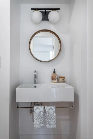 a bathroom with a sink and a mirror