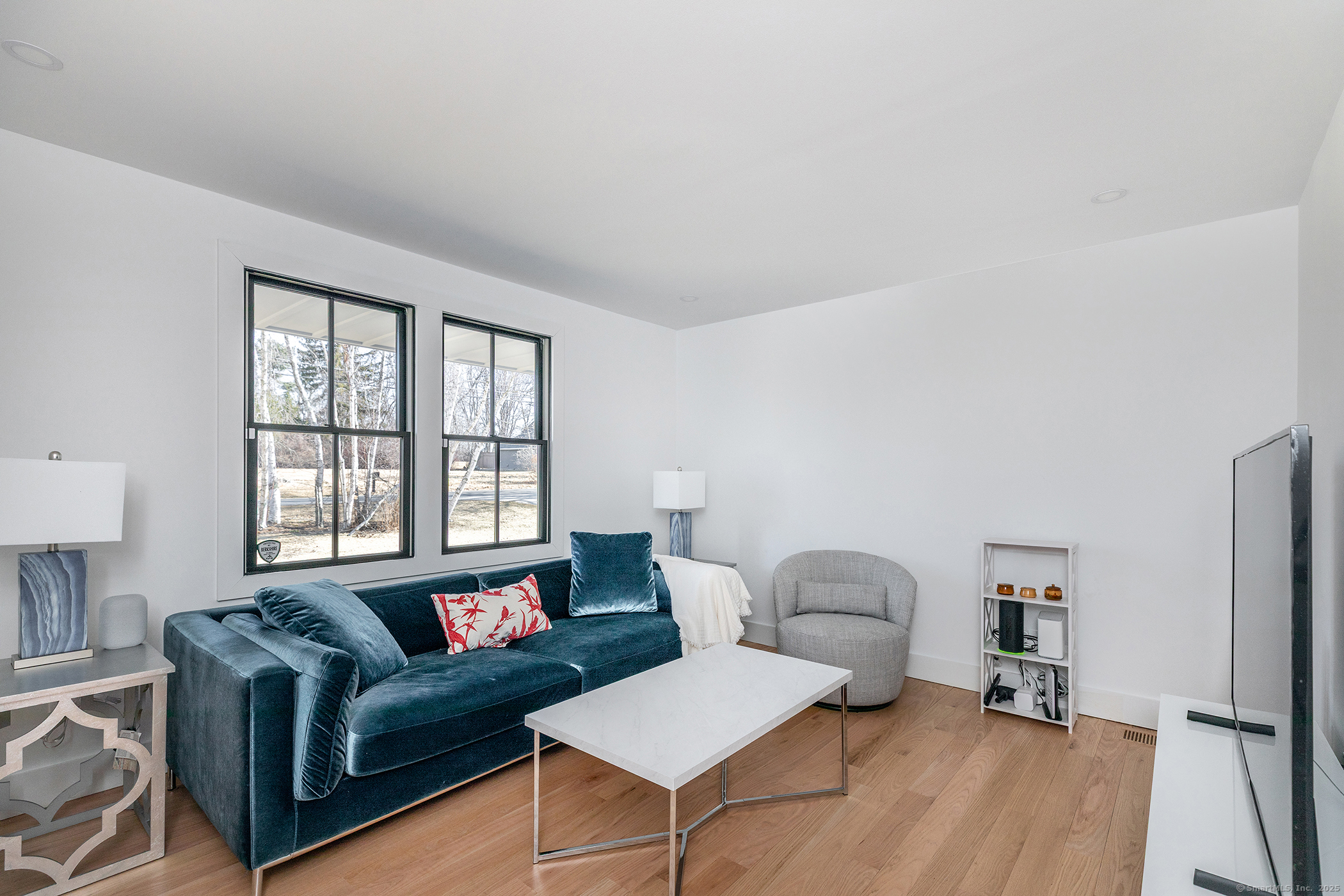 323 Wells Hill Road Salisbury, CT 06039 - Photo 15 of 31 a living room with furniture and a window