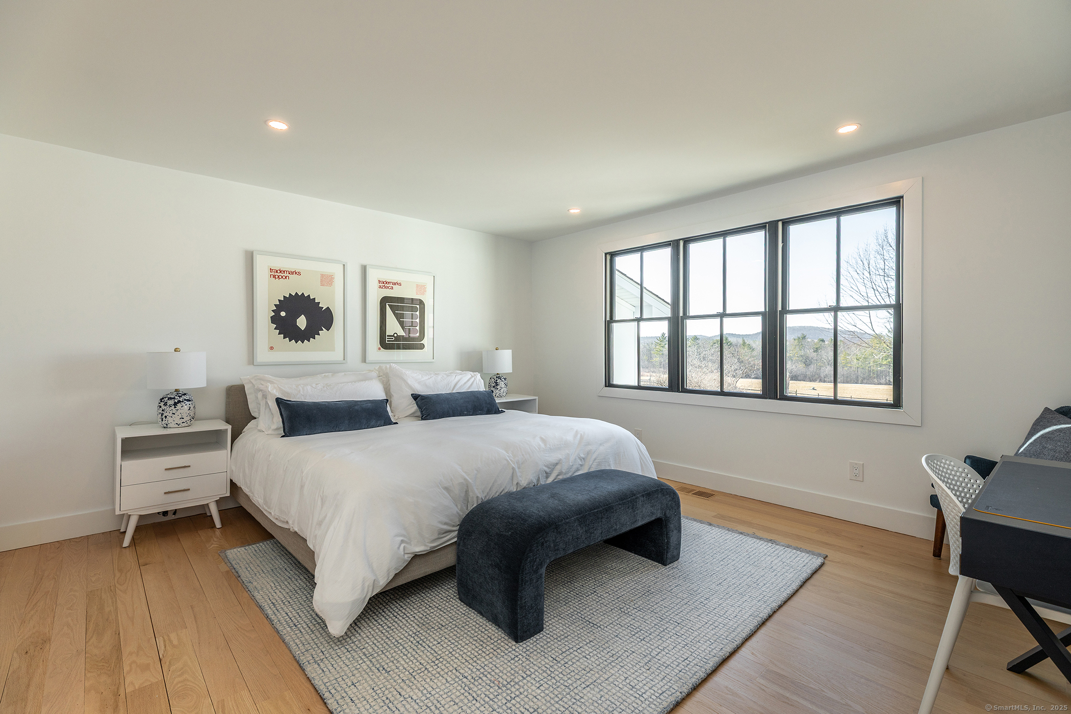 323 Wells Hill Road Salisbury, CT 06039 - Photo 16 of 31 a bedroom with a bed and a large window
