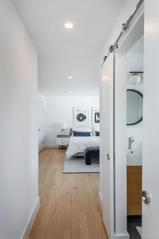 a en suite bathroom with a sink and mirror