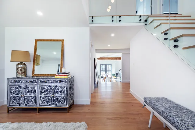 a view of living room with granite countertop furniture and wooden floor
