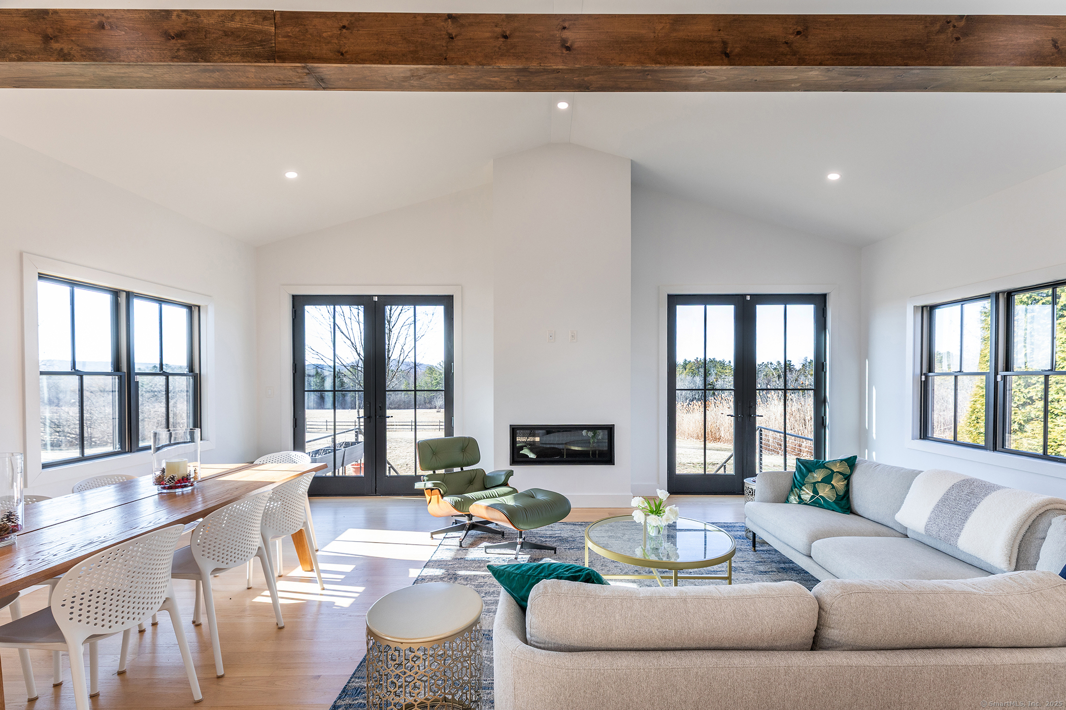 323 Wells Hill Road Salisbury, CT 06039 - Photo 6 of 31 a living room with furniture and large windows