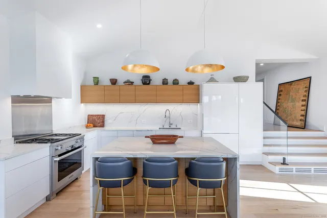 a kitchen with a table and chairs in it