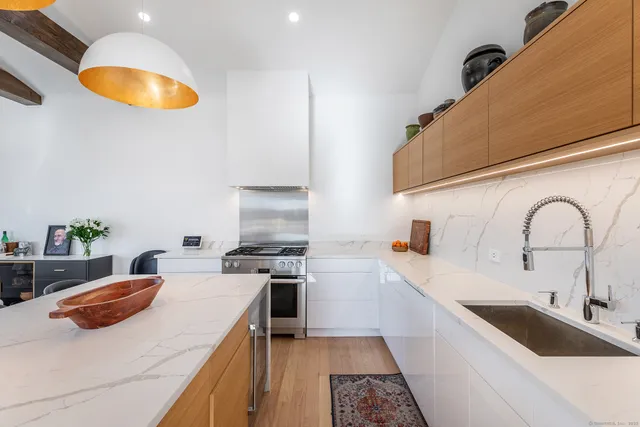 a kitchen with a sink and a stove