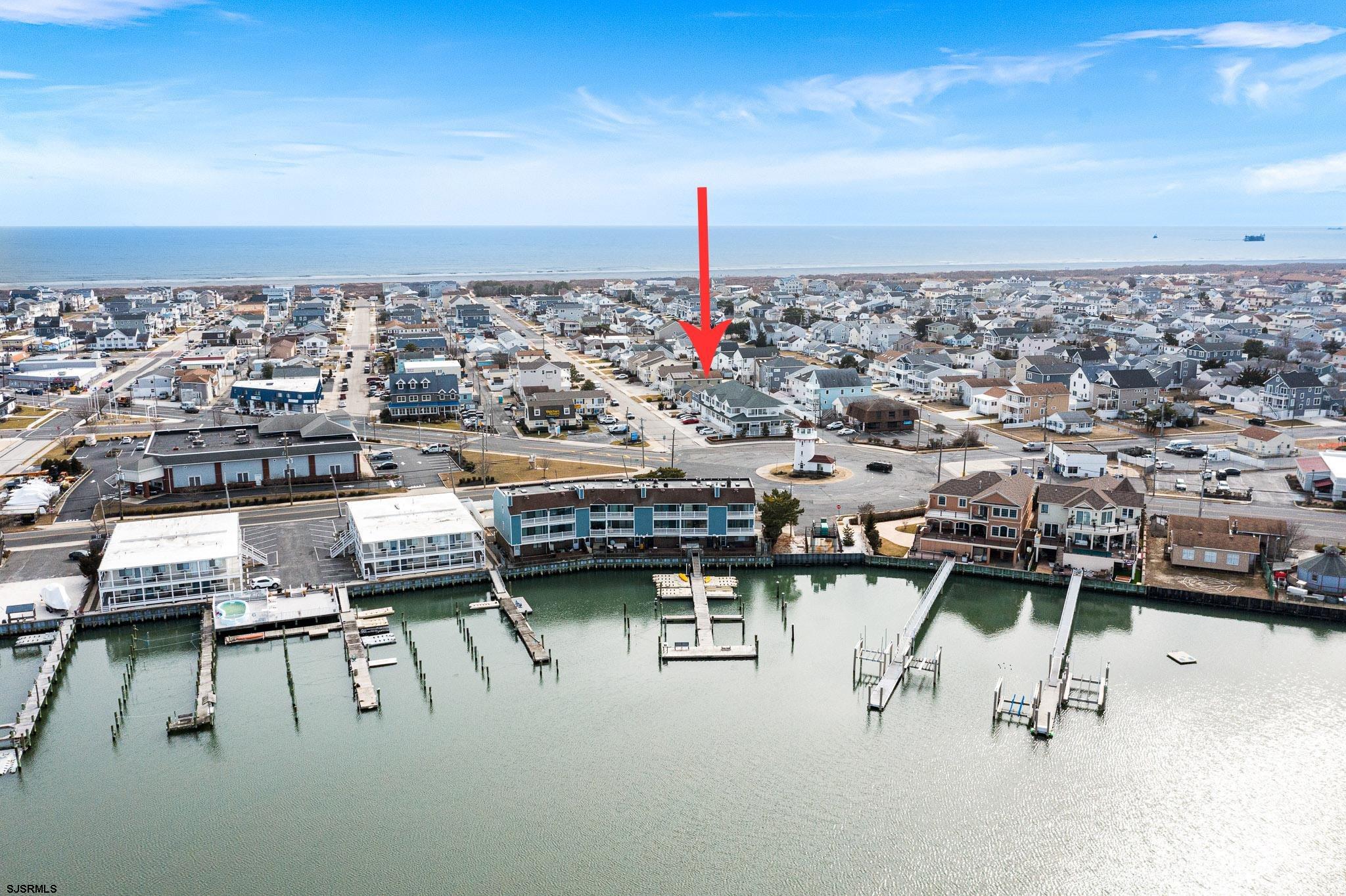 210 34th Street South, Unit 2 Brigantine, NJ 08203 - Photo 32 of 32 a terrace with a table and chairs