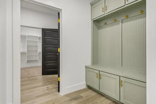 a kitchen with granite countertop a stove and a wooden floor