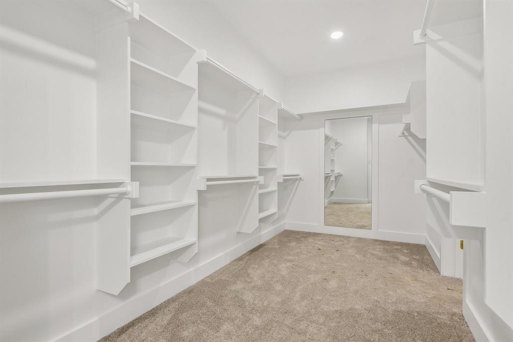 6605 Buffalo Ridge Circle Godley, TX 76044 - Photo 22 of 38 a view of walk in closet with empty racks