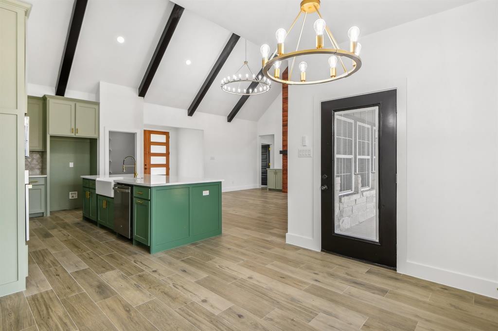 6605 Buffalo Ridge Circle Godley, TX 76044 - Photo 23 of 38 a view of a kitchen with furniture and a chandelier