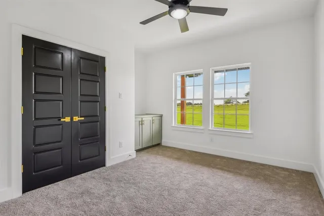 a view of hallway with wooden floor