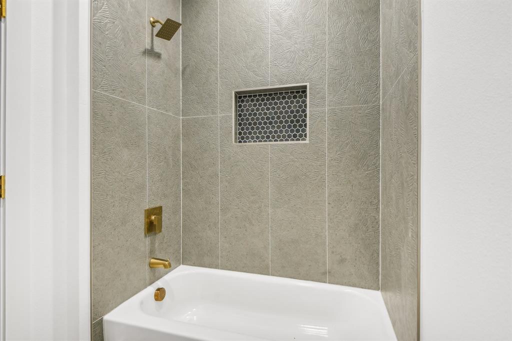 6605 Buffalo Ridge Circle Godley, TX 76044 - Photo 31 of 38 a bathroom with a sink and a tub