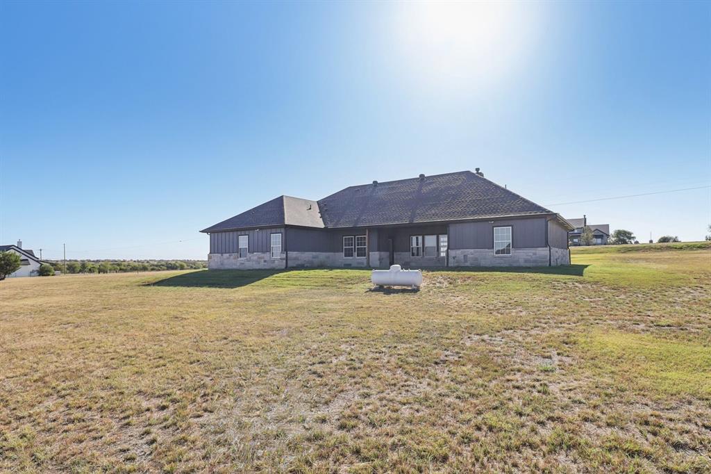 6605 Buffalo Ridge Circle Godley, TX 76044 - Photo 36 of 38 a house view with a swimming pool