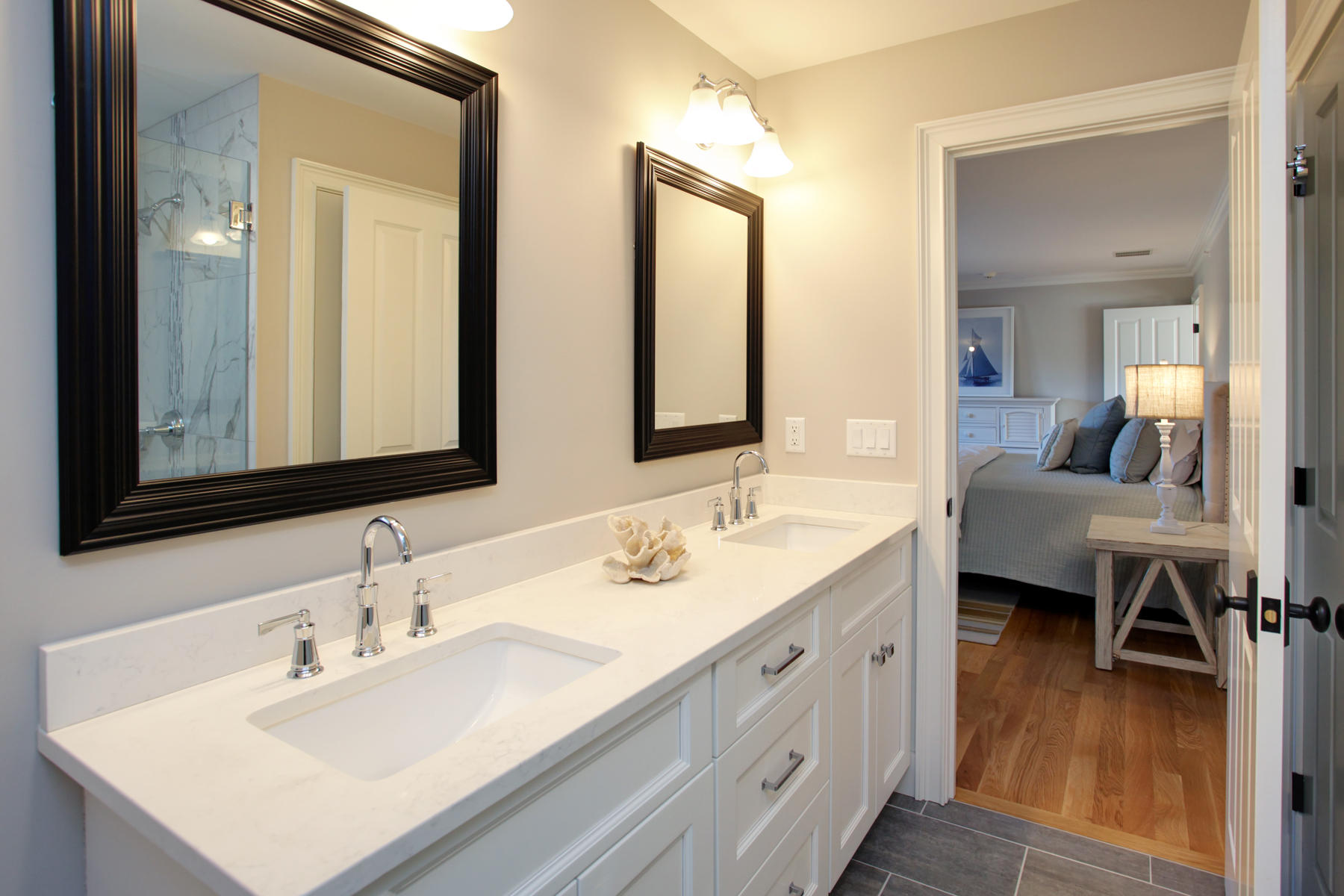 1090 Shore Road, Unit 8 Pocasset, MA 02559 - Photo 17 of 32 a en suite bathroom with a double vanity sink and a mirror