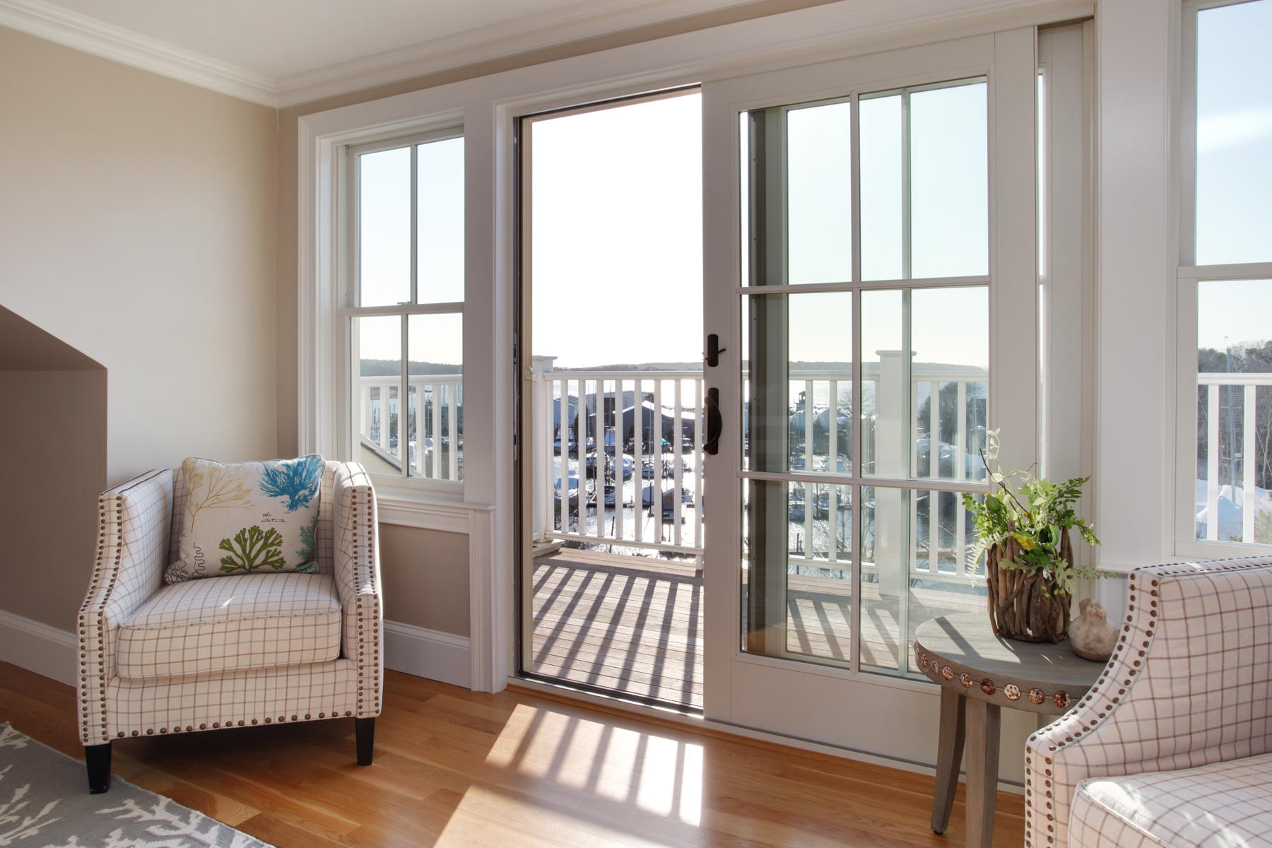1090 Shore Road, Unit 8 Pocasset, MA 02559 - Photo 19 of 32 a living room with furniture and a floor to ceiling window