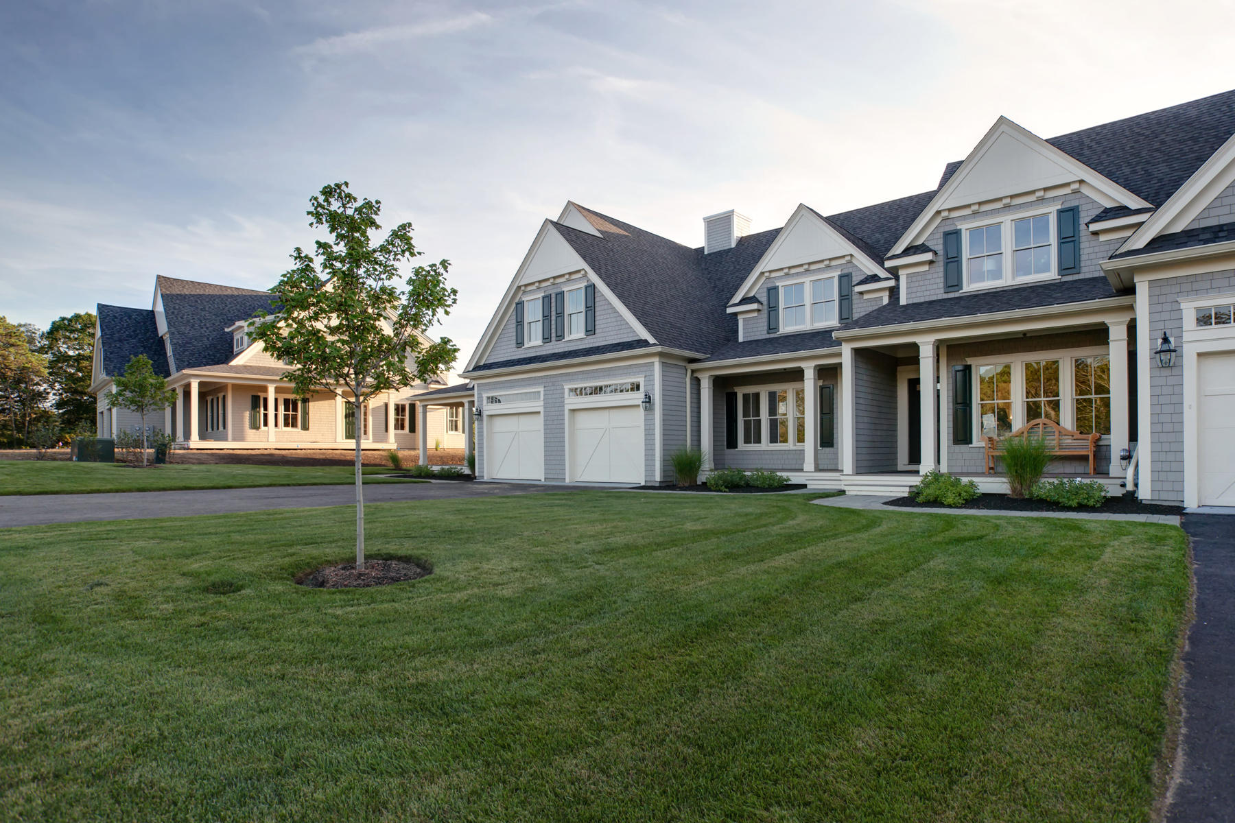 1090 Shore Road, Unit 8 Pocasset, MA 02559 - Photo 2 of 32 a front view of a house with a garden