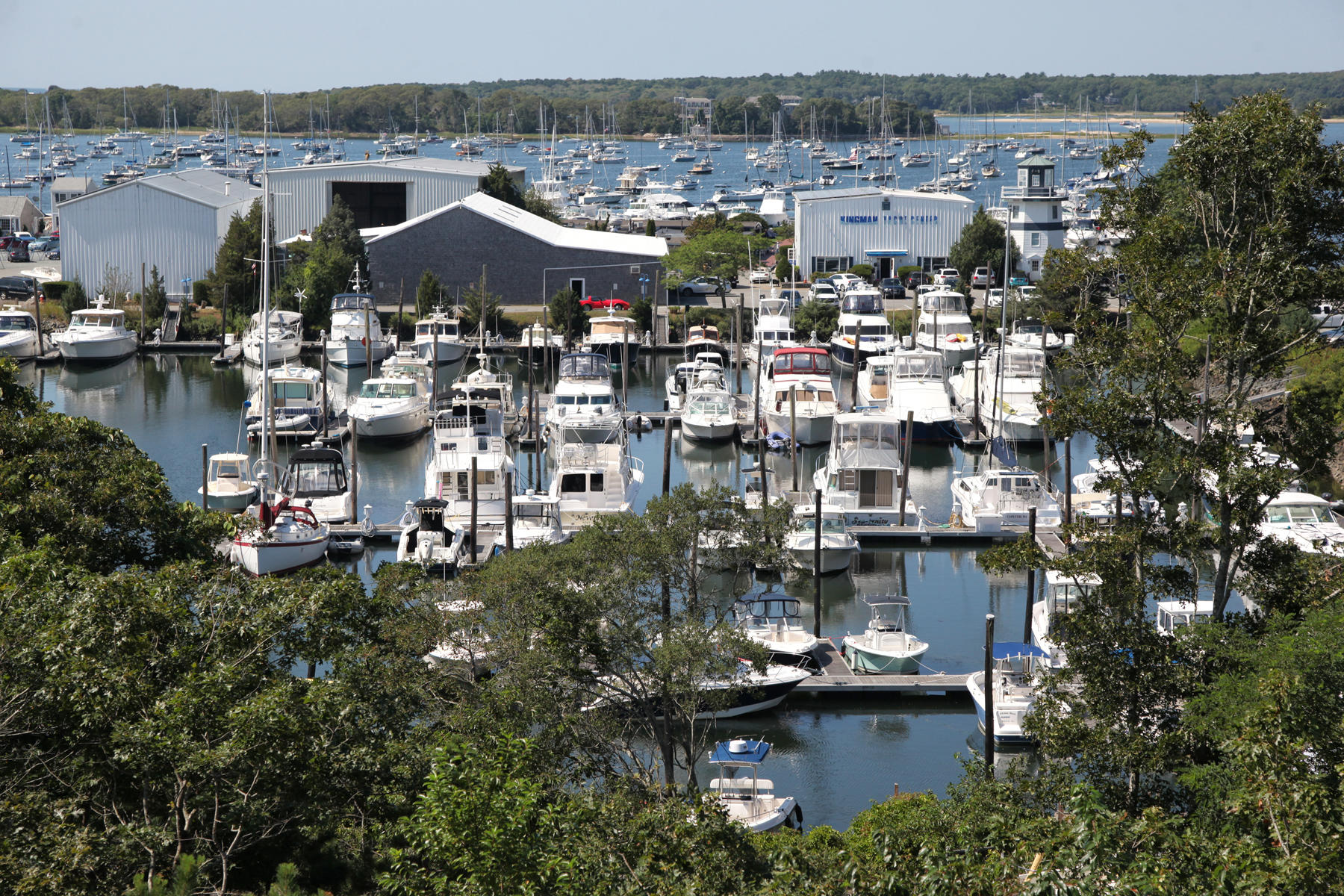 1090 Shore Road, Unit 8 Pocasset, MA 02559 - Photo 21 of 32 a view of a lake with a lot of houses