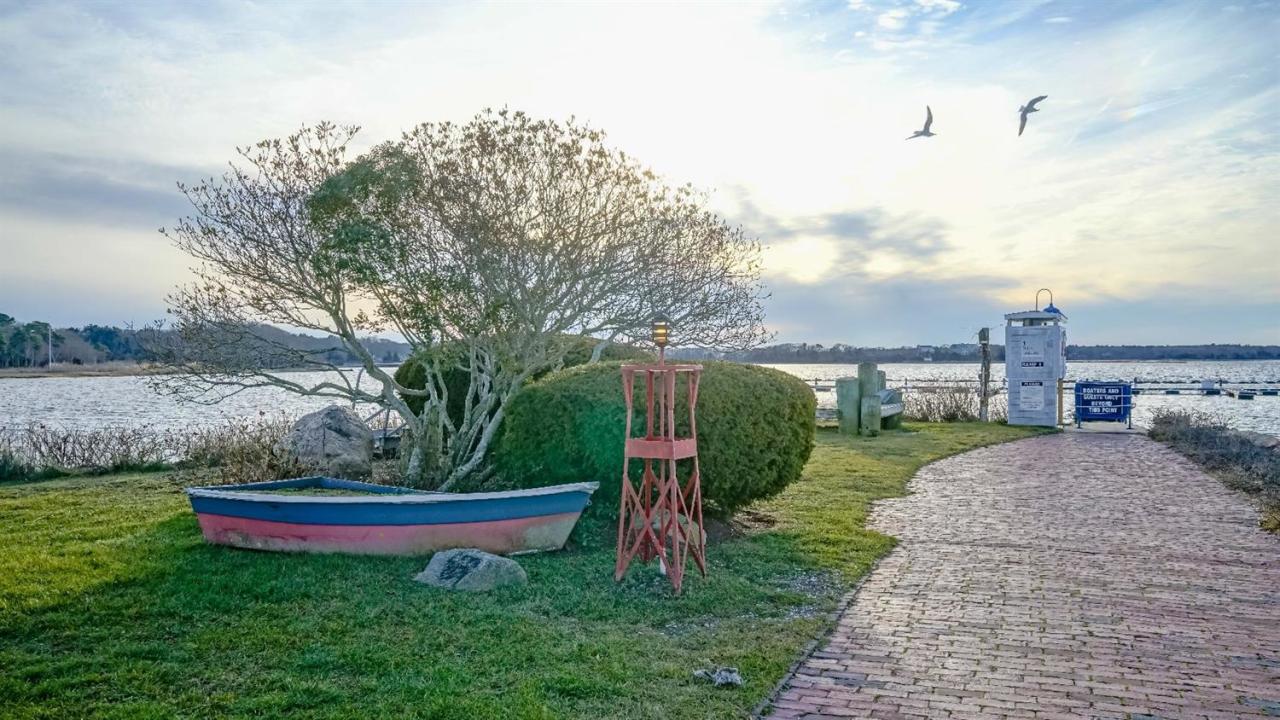 1090 Shore Road, Unit 8 Pocasset, MA 02559 - Photo 31 of 32 a garden view with a fountain