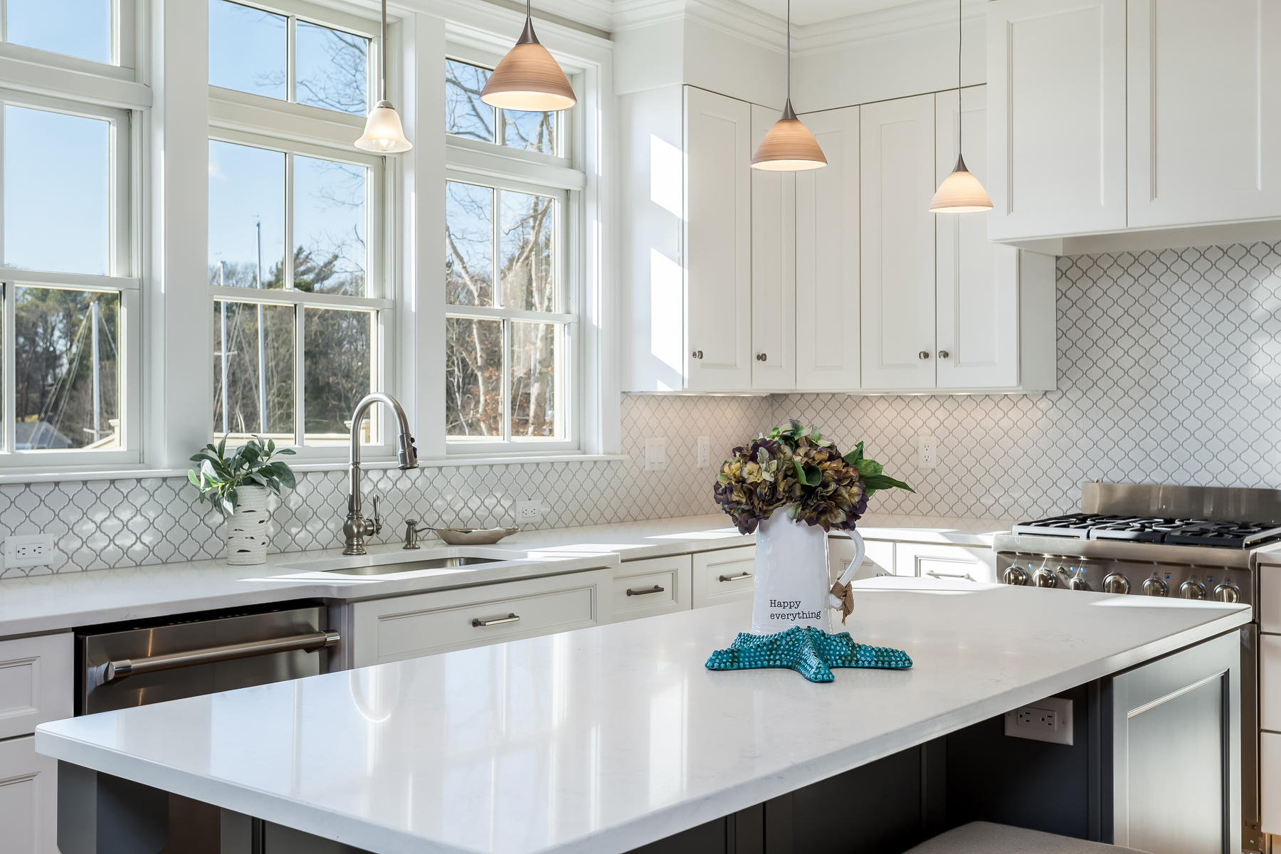 1090 Shore Road, Unit 8 Pocasset, MA 02559 - Photo 8 of 32 a kitchen with stainless steel appliances white cabinets and wooden floor
