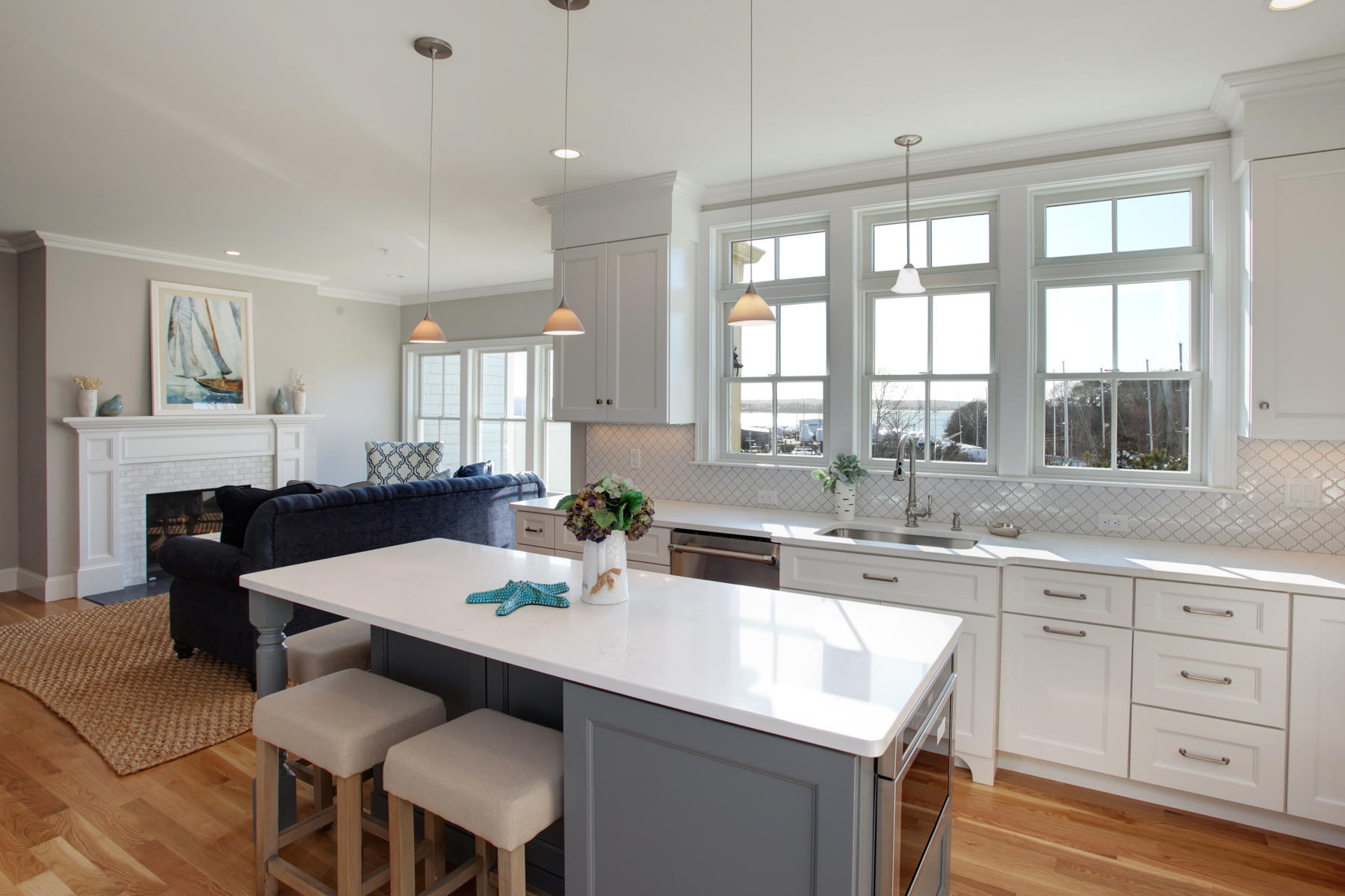 1090 Shore Road, Unit 8 Pocasset, MA 02559 - Photo 9 of 32 a kitchen with a table chairs sink and cabinets