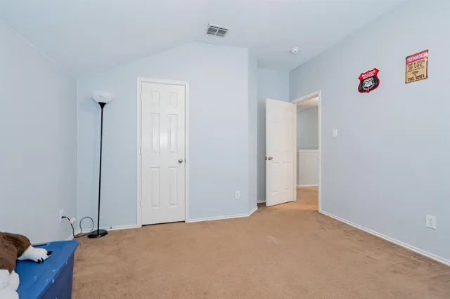 a bed room with a bed and a chandelier