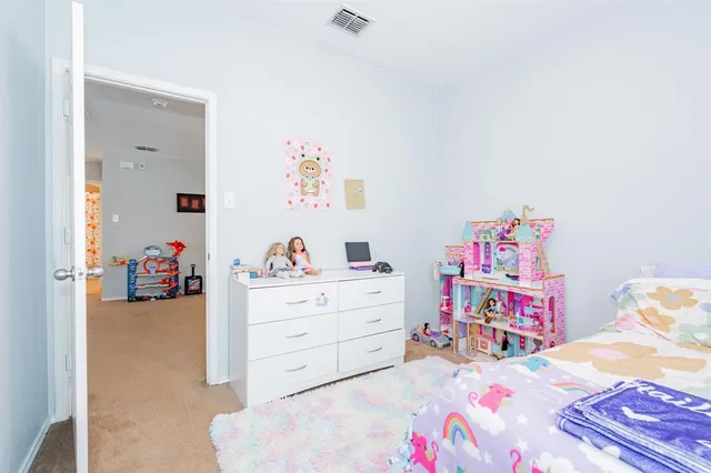 a bed room with a bed and cabinets