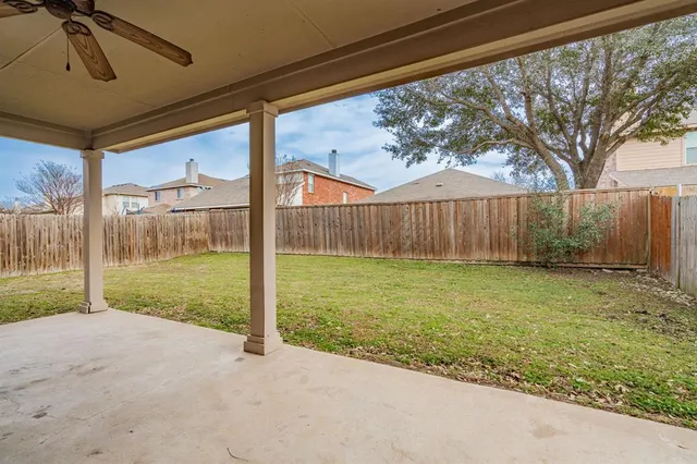 a view of backyard with green space