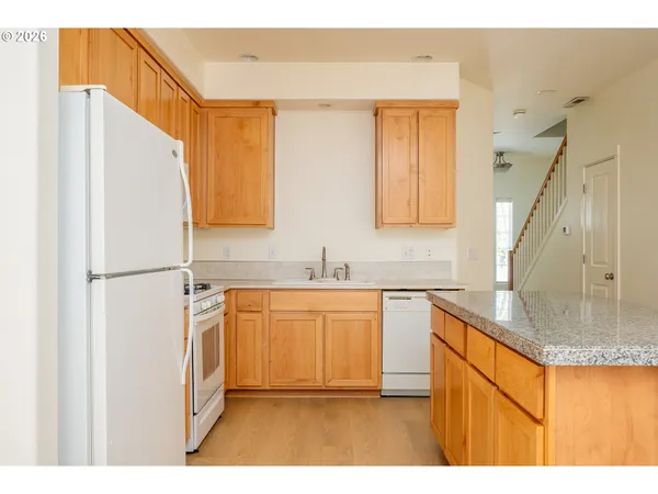 a kitchen with stainless steel appliances granite countertop a granite counter tops and a sink
