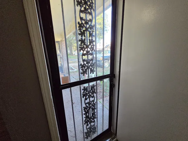 a bathroom with a sink a light fixture and a mirror