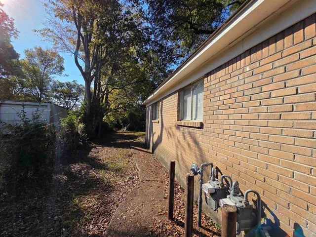 a backyard of a house with lots of green space