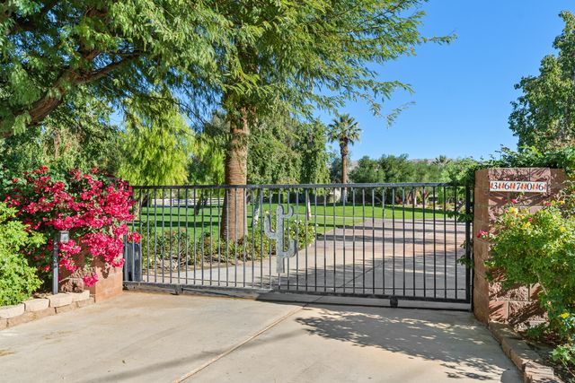 a view of a park with a street sign