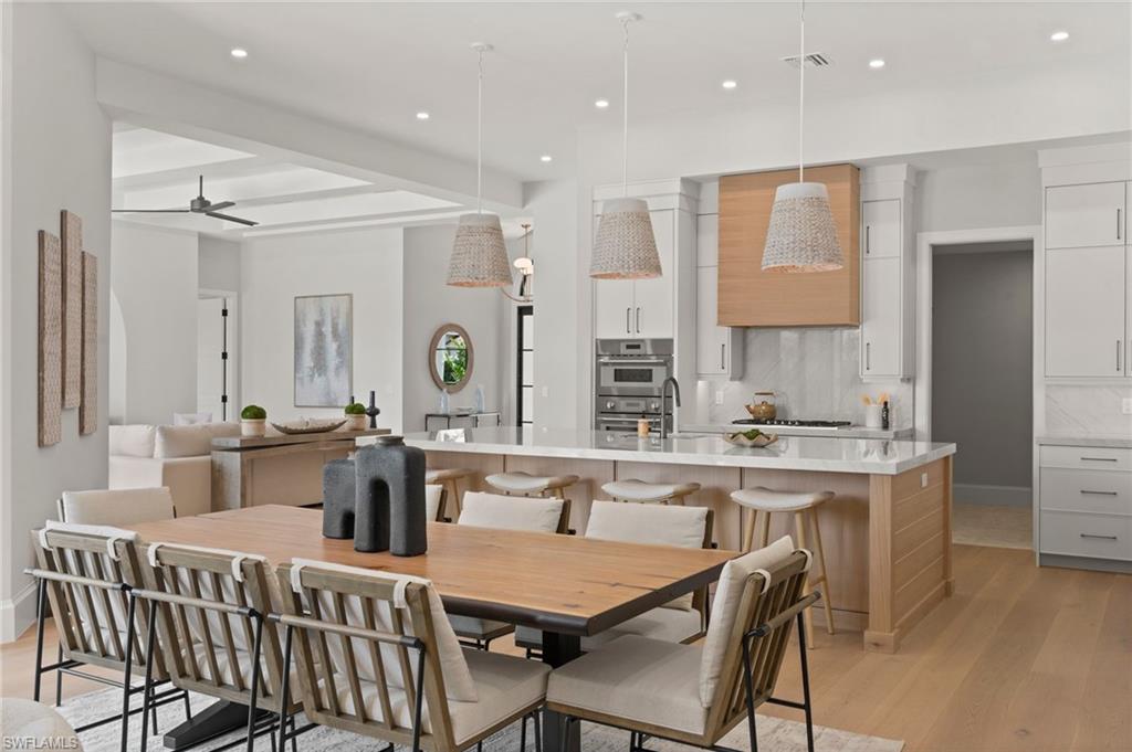 207 Monterey Drive Naples, FL 34119 - Photo 15 of 47 a large kitchen with a table and chairs