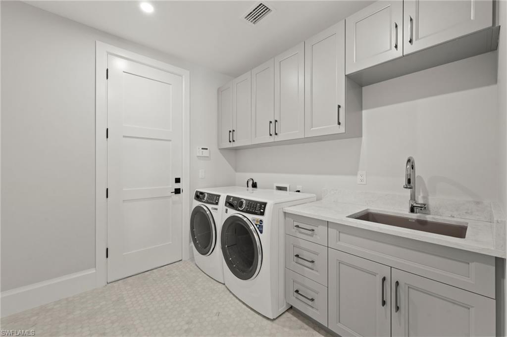 207 Monterey Drive Naples, FL 34119 - Photo 34 of 47 a utility room with sink dryer and washer