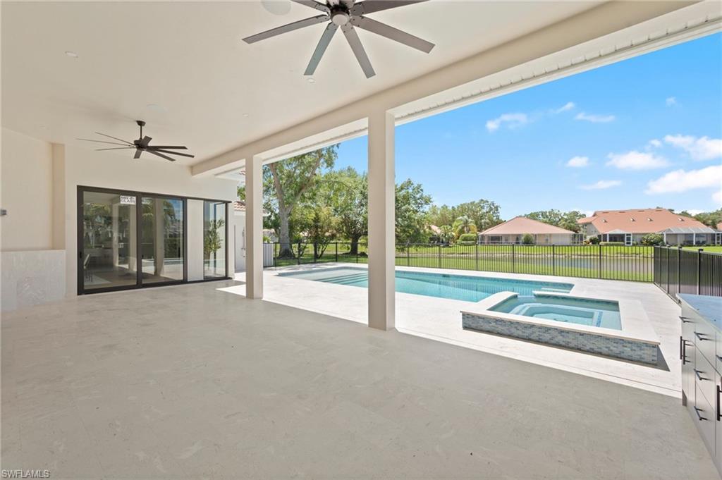 207 Monterey Drive Naples, FL 34119 - Photo 37 of 47 a view of a patio with a swimming pool