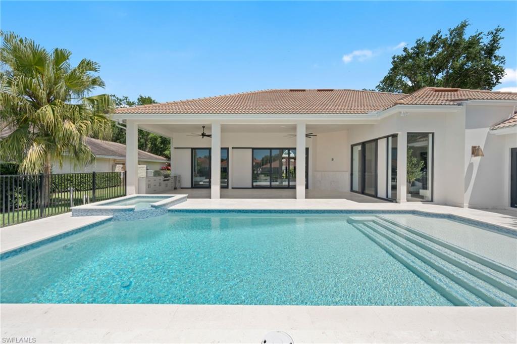 207 Monterey Drive Naples, FL 34119 - Photo 39 of 47 a house view with a garden space