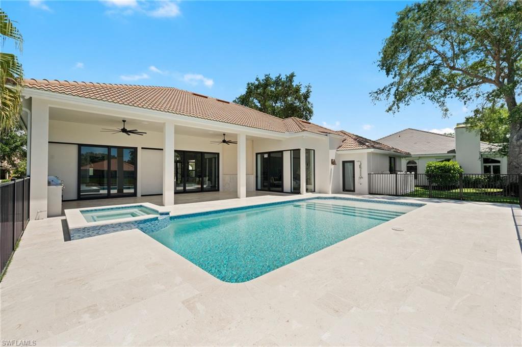 207 Monterey Drive Naples, FL 34119 - Photo 40 of 47 a view of house with swimming pool and view of a house