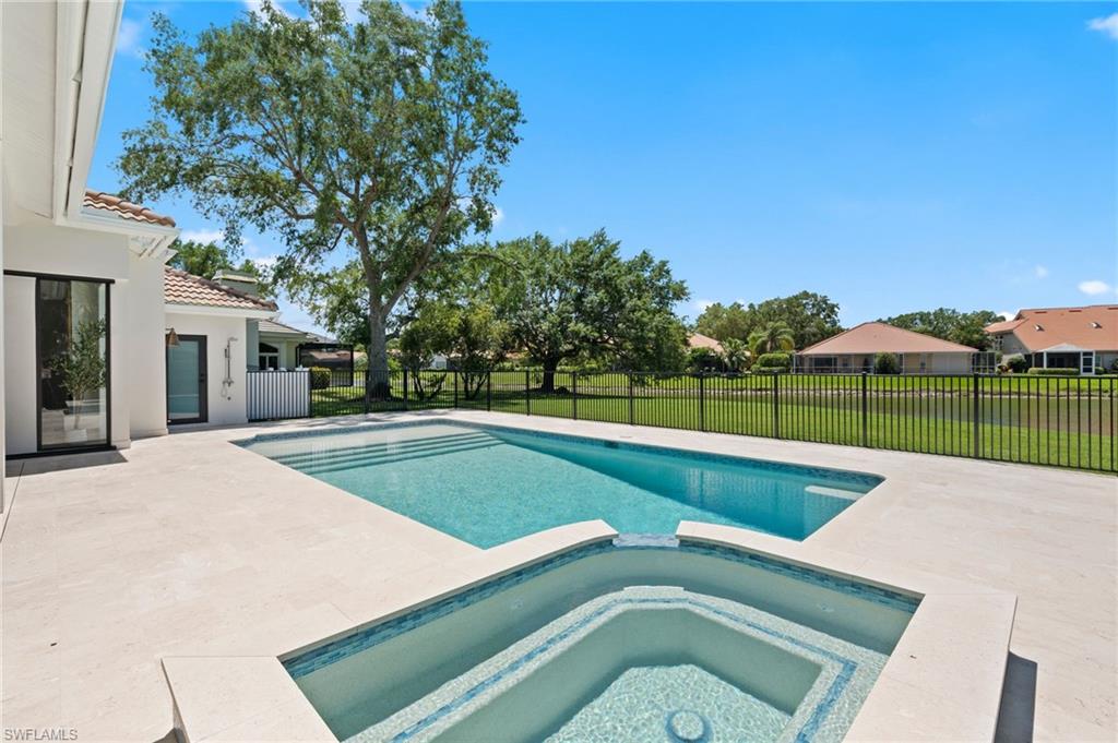 207 Monterey Drive Naples, FL 34119 - Photo 41 of 47 a view of a backyard with a swimming pool