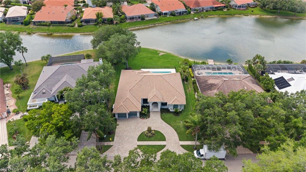 207 Monterey Drive Naples, FL 34119 - Photo 43 of 47 an aerial view of a house with a lake view