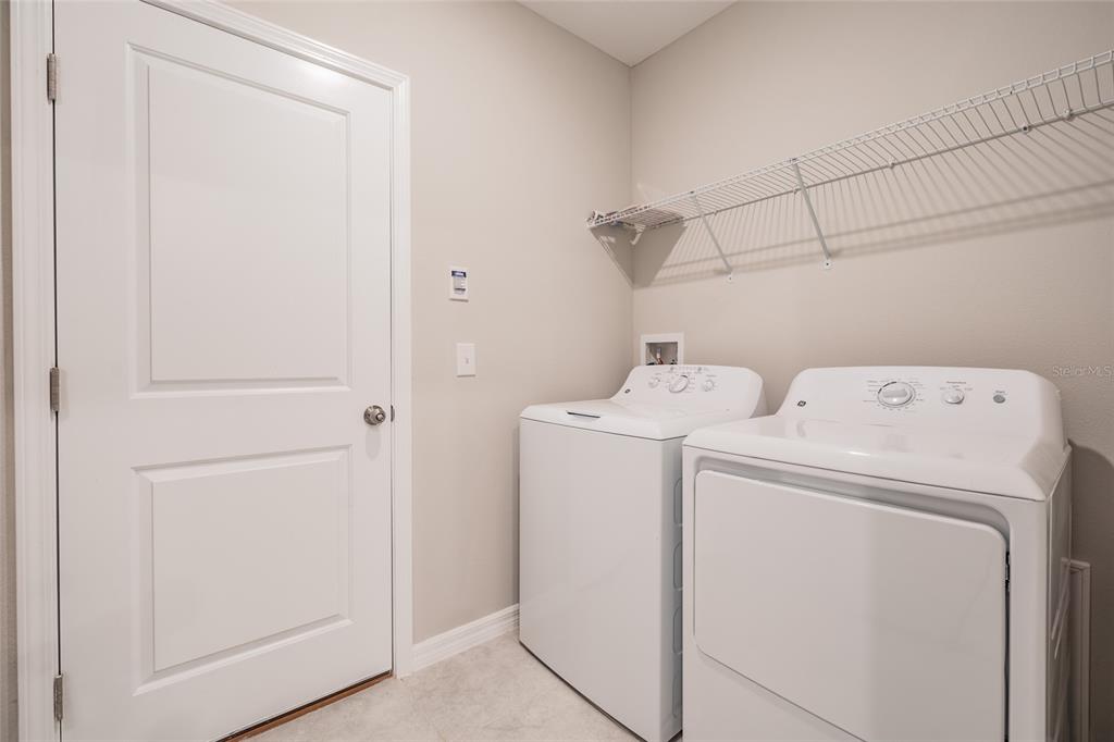 31807 Barrel Wave Way Wesley Chapel, FL 33545 - Photo 36 of 61 a utility room with dryer and washer
